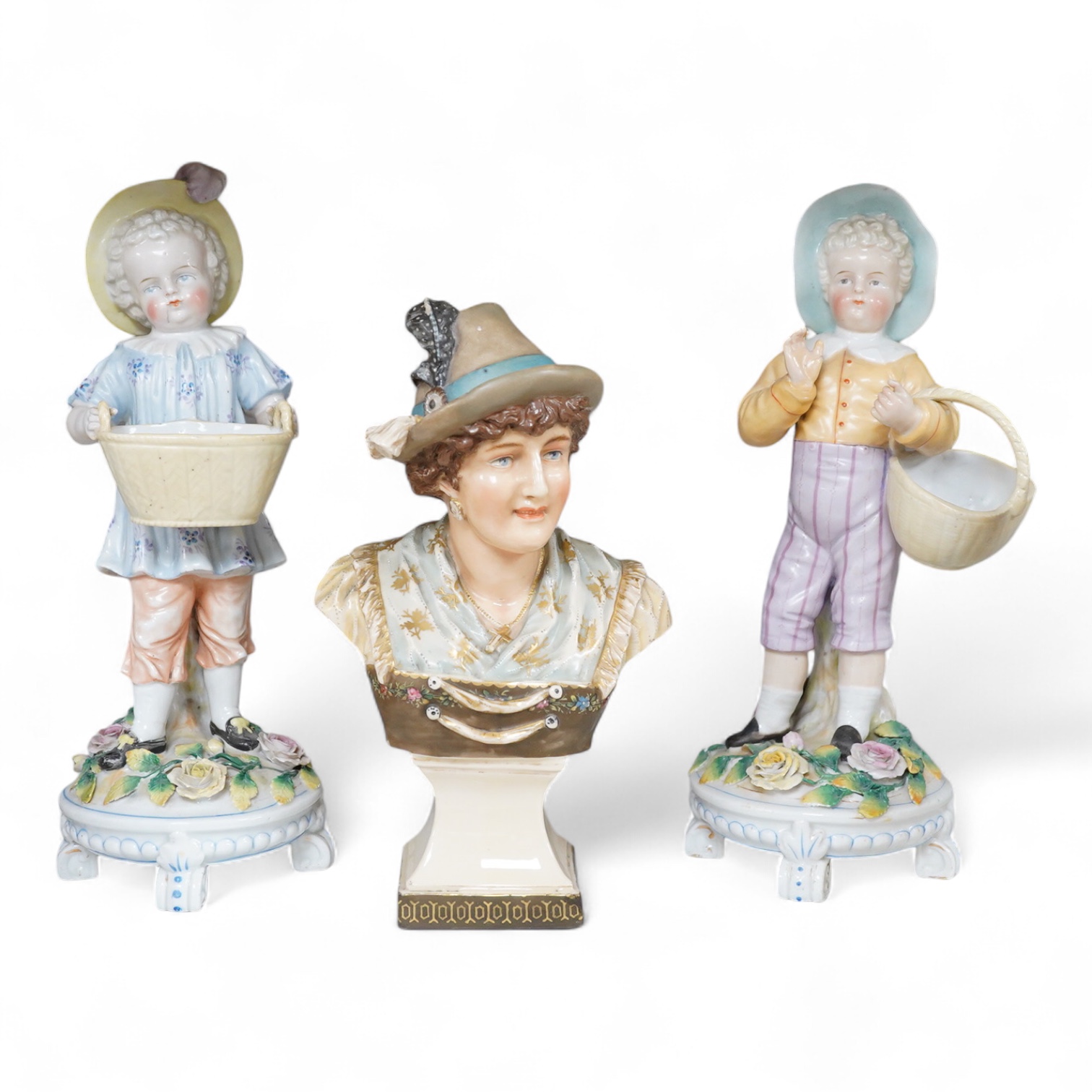 A pair of Volkstedt figures, 30cm high and a Royal Dux portrait bust